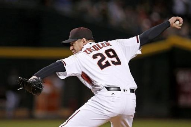 Arizona Diamondbacks' Brad Ziegler throws a pitch against the Los Angeles Dodgers during the ninth inning of a baseball game Monday, June 13, 2016, in Phoenix. The Diamondbacks defeated the Dodgers 3-2. (AP Photo/Ross D. Franklin)