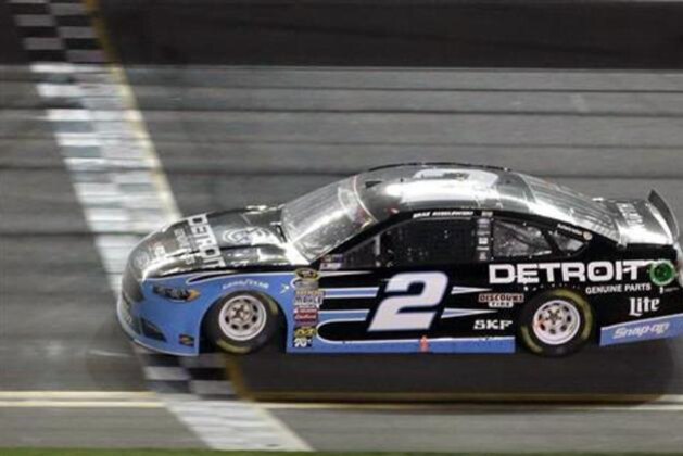 Brad Keselowski crosses the start-finish line to win the NASCAR Sprint Cup Series auto race at Daytona International Speedway, Saturday, July 2, 2016, in Daytona Beach, Fla. (AP Photo/John Raoux)