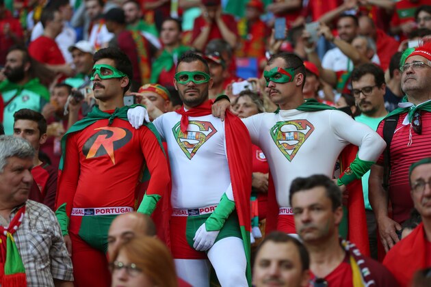 LYON, FRANCE - JULY 06:  Fans of Portugal wearing Superman costumes during the UEFA Euro 2016 semi final match between Portugal and Wales at Stade des Lumieres on July 6, 2016 in Lyon, France. (Photo by Catherine Ivill - AMA/Getty Images)