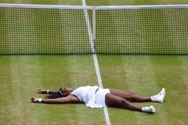 Serena Williams of the U.S celebrates after beating Angelique Kerber of Germany in the women's singles final on day thirteen of the Wimbledon Tennis Championships in London, Saturday, July 9, 2016. (Andy Rain/Pool Photo via AP)