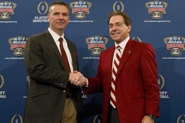 Ohio State coach Urban Meyer, left, and Alabama head coach Nick Saban shake hands during a press conference at the Marriott downtown convention center in New Orleans, Wednesday, Dec. 31, 2014. Ohio State is slated to square off against Alabama in the Sugar Bowl on New Year's Day. (AP Photo/Brynn Anderson)
