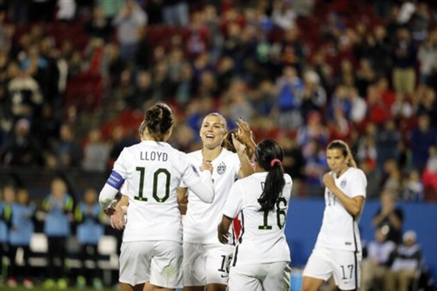 United States' Carli Lloyd (10) and Crystal Dunn (16) congratulate Alex Morgan, center, on her goal against Costa Rica during the second half of a CONCACAF Olympic qualifying tournament soccer match Wednesday, Feb. 10, 2016, in Frisco, Texas. (AP Photo/Tony Gutierrez)