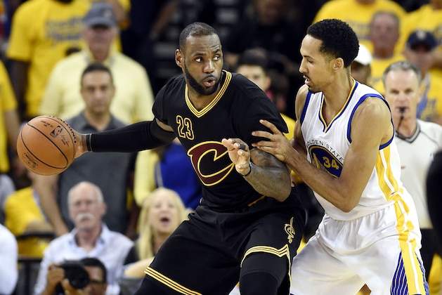 Jun 19, 2016; Oakland, CA, USA; Cleveland Cavaliers forward LeBron James (23) handles the ball against Golden State Warriors guard Shaun Livingston (34) during the third quarter in game seven of the NBA Finals at Oracle Arena. Mandatory Credit: Bob Donnan-USA TODAY Sports