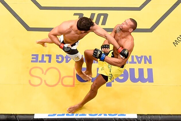 LAS VEGAS, NV - JULY 09: (L-R) Gegard Mousasi of The Netherlands punches Thiago Santos of Brazil in their middleweight bout during the UFC 200 event on July 9, 2016 at T-Mobile Arena in Las Vegas, Nevada.  (Photo by Josh Hedges/Zuffa LLC/Zuffa LLC via Getty Images)