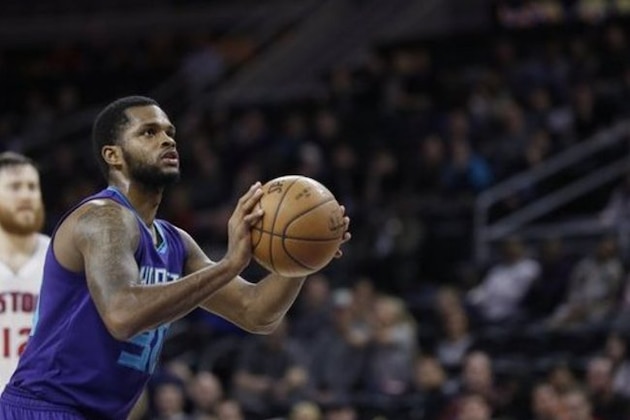 Charlotte Hornets guard Troy Daniels shoots a free throw during the second half of an NBA basketball game against the Detroit Pistons, Friday, March 25, 2016, in Auburn Hills, Mich. (AP Photo/Carlos Osorio)