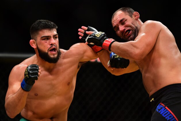 LAS VEGAS, NV - JULY 09: (L-R) Kelvin Gastelum punches Johny Hendricks in their welterweight bout during the UFC 200 event on July 9, 2016 at T-Mobile Arena in Las Vegas, Nevada.  (Photo by Harry How/Zuffa LLC/Zuffa LLC via Getty Images)