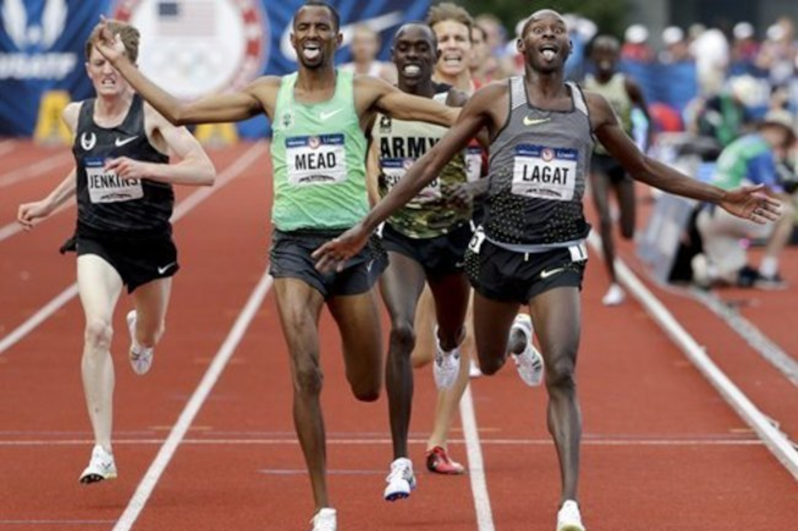 Bernard Lagat, right, wins in the finals of the men's 5000-meter run at the U.S. Olympic Track and Field Trials, Saturday, July 9, 2016, in Eugene Ore. (AP Photo/Marcio Jose Sanchez)
