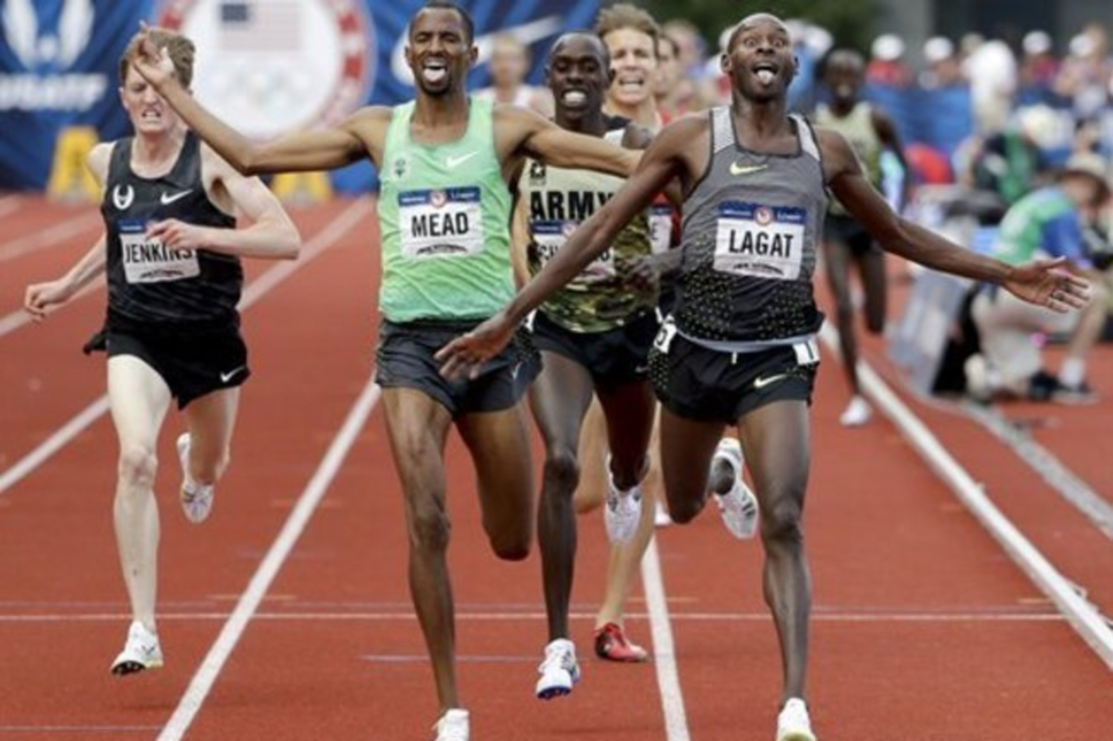 Bernard Lagat, right, wins in the finals of the men's 5000-meter run at the U.S. Olympic Track and Field Trials, Saturday, July 9, 2016, in Eugene Ore. (AP Photo/Marcio Jose Sanchez)