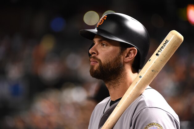 PHOENIX, AZ - JULY 01:  Brandon Belt #9 of the San Francisco Giants gets ready to step into the batters box against the Arizona Diamondbacks at Chase Field on July 1, 2016 in Phoenix, Arizona.  (Photo by Norm Hall/Getty Images)