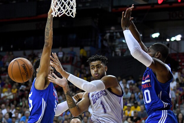 Jul 9, 2016; Las Vegas, NV, USA; Los Angeles Lakers guard D'Angelo Russell (1) passes the ball out of double coverage during an NBA Summer League game against the Philadelphia 76ers at Thomas & Mack Center. Los Angeles won 70-69. Mandatory Credit: Stephen R. Sylvanie-USA TODAY Sports