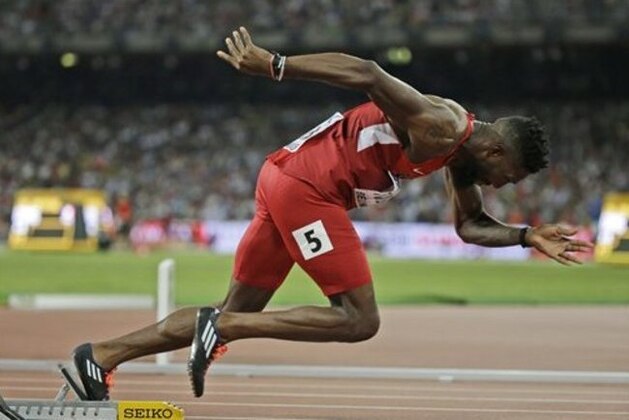 United States' Michael Tinsley starts to run in men’s 400m hurdles final at the World Athletics Championships at the Bird's Nest stadium in Beijing, Tuesday, Aug. 25, 2015. (AP Photo/David J. Phillip)