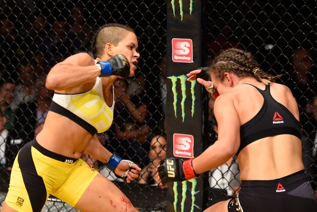 LAS VEGAS, NV - JULY 09: (L-R) Amanda Nunes of Brazil punches Miesha Tate in their UFC women's bantamweight championship bout during the UFC 200 event on July 9, 2016 at T-Mobile Arena in Las Vegas, Nevada.  (Photo by Josh Hedges/Zuffa LLC/Zuffa LLC via Getty Images)