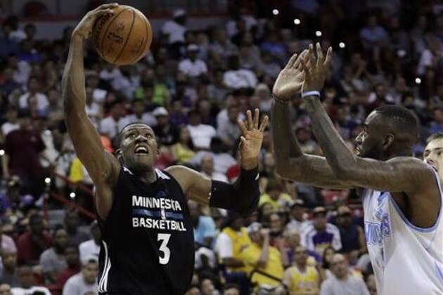 Minnesota Timberwolves' Kris Dunn shoots against the Denver Nuggets during the second half of an NBA summer league basketball game Friday, July 8, 2016, in Las Vegas. (AP Photo/John Locher)