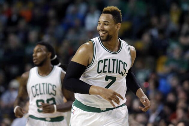Boston Celtics center Jared Sullinger (7) smiles after scoring against the Milwaukee Bucks in the second half of an NBA game, Friday, April 8, 2016, in Boston. The Celtics won 124-109. At left is Celtics forward Jae Crowder. (AP Photo/Elise Amendola)