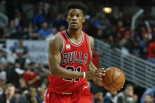 Chicago Bulls guard Jimmy Butler looks to pass the ball against the Philadelphia 76ers during the second half of an NBA basketball game, Wednesday, April 13, 2016 in Chicago. The Bulls won 115-105. (AP Photo/Kamil Krzaczynski)