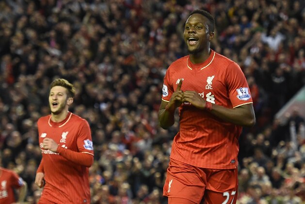 Liverpool's Belgian striker Divock Origi (R) celebrates after scoring during the English Premier League football match between Liverpool and Everton at Anfield in Liverpool, north west England on April 20, 2016. / AFP / PAUL ELLIS / RESTRICTED TO EDITORIAL USE. No use with unauthorized audio, video, data, fixture lists, club/league logos or 'live' services. Online in-match use limited to 75 images, no video emulation. No use in betting, games or single club/league/player publications.  /         (Photo credit should read PAUL ELLIS/AFP/Getty Images)
