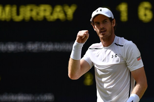 Britain's Andy Murray celebrates winning the second set against Canada's Milos Raonic during the men's singles final match on the last day of the 2016 Wimbledon Championships at The All England Lawn Tennis Club in Wimbledon, southwest London, on July 10, 2016. / AFP / LEON NEAL / RESTRICTED TO EDITORIAL USE        (Photo credit should read LEON NEAL/AFP/Getty Images)