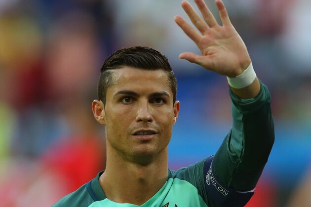 LYON, FRANCE - JULY 06:  Cristiano Ronaldo of Portugal waves before the UEFA Euro 2016 semi final match between Portugal and Wales at Stade des Lumieres on July 6, 2016 in Lyon, France. (Photo by Catherine Ivill - AMA/Getty Images)