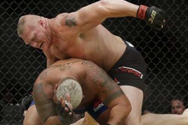 Brock Lesnar, top, fights Mark Hunt during their heavyweight mixed martial arts bout at UFC 200, Saturday, July 9, 2016, in Las Vegas. (AP Photo/John Locher)