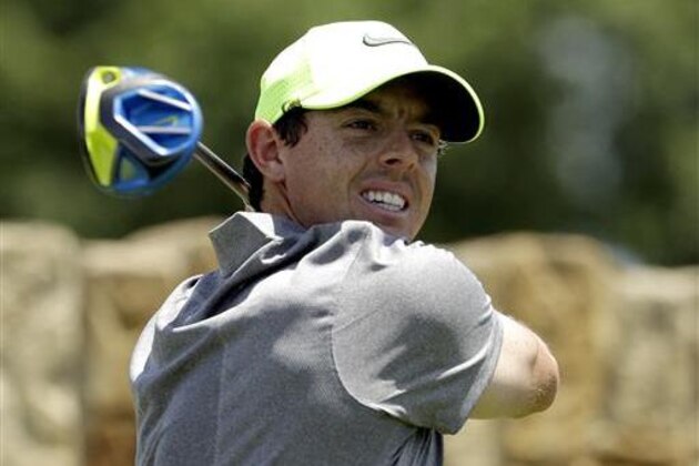 FILE - In this Saturday, June 18, 2016 file photo, Rory McIlroy, of Northern Ireland, watches his tee shot on the ninth hole during the rain delayed second round of the U.S. Open golf championship at Oakmont Country Club, in Oakmont, Pa. The British Open is scheduled for July 14–17, 2016, at Royal Troon Golf Club in Ayrshire, Scotland.  (AP Photo/Charlie Riedel, File)
