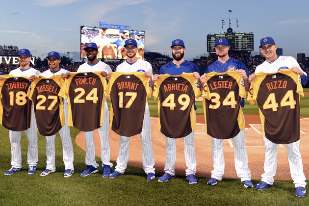 CHICAGO, IL - JULY 7: (L-R) Chicago Cubs National League All Stars, Ben Zobrist #18, Addison Russell #27, Dexter Fowler #24, Kris Bryant #17, Jake Arrieta #49, Jon Lester #34 and Anthony Rizzo #44 pose for a photo with their All Star jersey's before the game against the Atlanta Braves on July 7, 2016 at Wrigley Field in Chicago, Illinois. (Photo by David Banks/Getty Images)