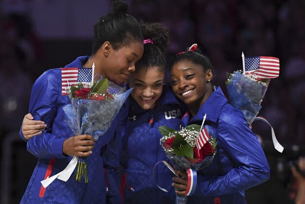 July 10, 2016; San Jose, CA, USA; Gabby Douglas (left), Laurie Hernandez (center), and Simone Biles (right) hug after the women's gymnastics U.S. Olympic team trials at SAP Center. Mandatory Credit: Kyle Terada-USA TODAY Sports