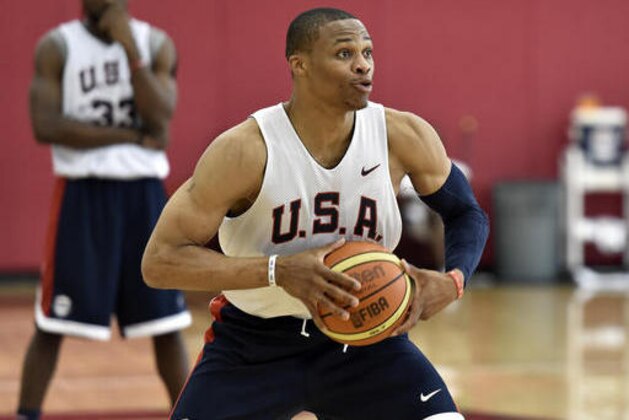 FILE - In this Aug. 11, 2015, file photo, Russell Westbrook looks to pass the ball during the U.S. men's basketball team's minicamp in Las Vegas. Westbrook says he won't play in the Olympics, leaving the U.S. basketball team without another of its best players. The Oklahoma City point guard said Friday, June 10, 2016,  that he decided not to play after talking with his family. He didn't give a reason for pulling out in his statement released through the Thunder. ((AP Photo/David Becker, File)