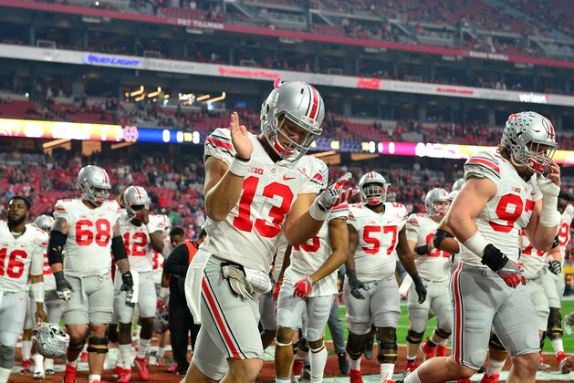 GLENDALE, AZ - JANUARY 01: Quarterback Stephen Collier #13 of the Ohio State Buckeyes walks onto the field before the BattleFrog Fiesta Bowl against the Notre Dame Fighting Irish at University of Phoenix Stadium on January 1, 2016 in Glendale, Arizona.  (Photo by Jennifer Stewart/Getty Images)