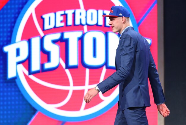 Jun 23, 2016; New York, NY, USA; Henry Ellenson (Marquette) walks off stage after being selected as the number eighteen overall pick to the Detroit Pistons in the first round of the 2016 NBA Draft at Barclays Center. Mandatory Credit: Jerry Lai-USA TODAY Sports
