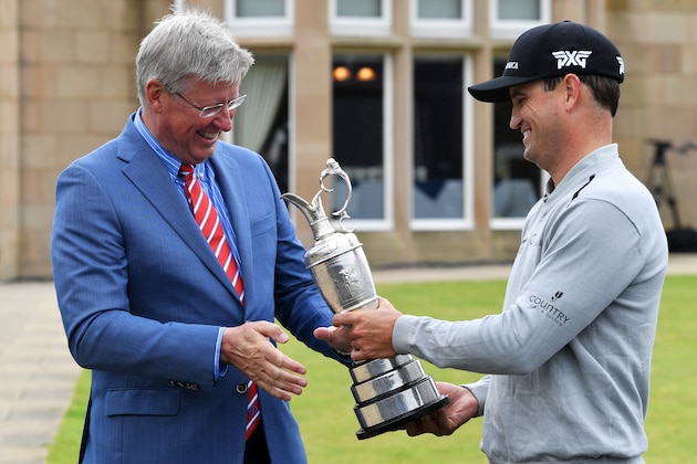 TROON, SCOTLAND - JULY 11:  Zach Johnson of the United States hands the Claret Jug to Martin Slumbers, Chief Executive of R&A during previews ahead of the 145th Open Championship at Royal Troon on July 11, 2016 in Troon, Scotland.  (Photo by Stuart Franklin/Getty Images)