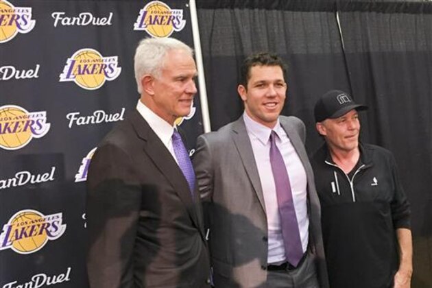 Los Angeles Lakers general managerMitch Kupchak, left, and team owner Jim Buss, right, introduce the team's new coach, Luke Walton, center, during a news conference in El Segundo, Calif., Tuesday, June 21, 2016.  (AP Photo/Greg Beacham)