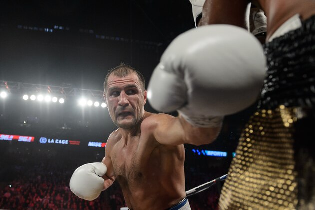 MONTREAL, QC - JANUARY 30:  Sergey Kovalev of Russia corners Jean Pascal of Canada during the WBO, WBA, and IBF light heavyweight world championship match at the Bell Centre on January 30, 2016 in Montreal, Quebec, Canada.  (Photo by Minas Panagiotakis/Getty Images)