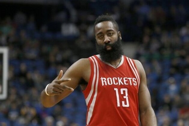 Houston Rockets guard James Harden (13) gestures to a teammate during the first half of an NBA basketball game against the Minnesota Timberwolves in Minneapolis, Monday, April 11, 2016. (AP Photo/Ann Heisenfelt)