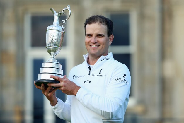 ST ANDREWS, SCOTLAND - JULY 20:  Zach Johnson of the United States holds the Claret Jug after winning the 144th Open Championship at The Old Course during a 4-hole playoff on July 20, 2015 in St Andrews, Scotland.  (Photo by Andrew Redington/Getty Images)