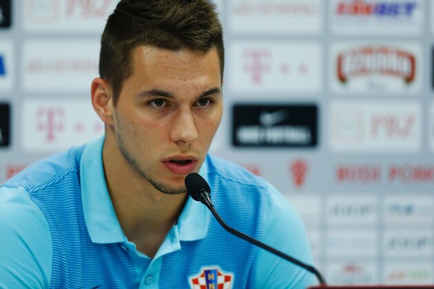 CORRECTION - Croatia's forward Marko Pjaca addresses a press conference in Deauville, north west France, on June 22, 2016, during the Euro 2016 football tournament.  / AFP / CHARLY TRIBALLEAU / The erroneous mention[s] appearing in the metadata of this photo by CHARLY TRIBALLEAU has been modified in AFP systems in the following manner: [Marko Pjaca] instead of [Milan Badelj]. Please immediately remove the erroneous mention[s] from all your online services and delete it (them) from your servers. If you have been authorized by AFP to distribute it (them) to third parties, please ensure that the same actions are carried out by them. Failure to promptly comply with these instructions will entail liability on your part for any continued or post notification usage. Therefore we thank you very much for all your attention and prompt action. We are sorry for the inconvenience this notification may cause and remain at your disposal for any further information you may require.        (Photo credit should read CHARLY TRI