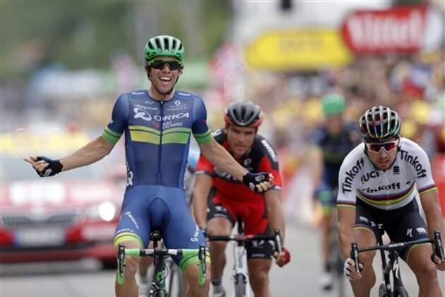 Australia’s Michael Matthews, left,  celebrates as he crosses the finish line head of Peter Sagan of Slovakia, right, to win the tenth stage of the Tour de France cycling race over 197 kilometers (122.4 miles) with start in Escaldes-Engordany, Andorra, and finish in Revel, France, Tuesday, July 12, 2016. (AP Photo/Christophe Ena)