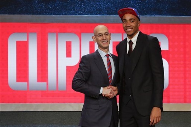 Brice Johnson, right, poses for a photo with NBA Commissioner Adam Silver after being selected 25th overall by the Los Angeles Clippers during the NBA basketball draft, Thursday, June 23, 2016, in New York. (AP Photo/Frank Franklin II)