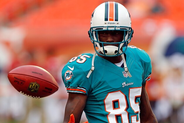 MIAMI GARDENS, FL - AUGUST 10:  Receiver Chad Johnson #85 of the Miami Dolphins warms up just before the start of the NFL Preseason Game against the Tampa Bay Buccaneers at Sun Life Stadium on August 10, 2012 in Miami Gardens, Florida.  (Photo by J. Meric/Getty Images)