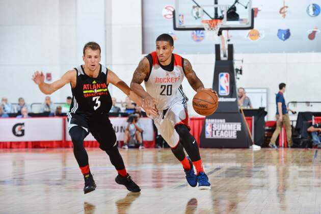 LAS VEGAS, NV - JULY 8:  Gary Payton II #20 of Houston Rockets handles the ball against Kevin Pangos #3 of the Atlanta Hawks during the 2016 NBA Las Vegas Summer League game on July 8, 2016 at the Cox Pavilion in Las Vegas, Nevada. NOTE TO USER: User expressly acknowledges and agrees that, by downloading and or using this photograph, User is consenting to the terms and conditions of the Getty Images License Agreement. Mandatory Copyright Notice: Copyright 2016 NBAE  (Photo by David Dow/NBAE via Getty Images)
