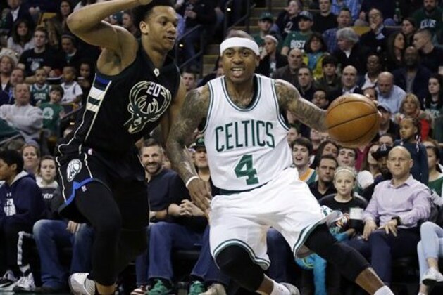 Boston Celtics guard Isaiah Thomas (4) drives against Milwaukee Bucks guard Rashad Vaughn (20) in the first half of an NBA game, Friday, April 8, 2016, in Boston. (AP Photo/Elise Amendola)