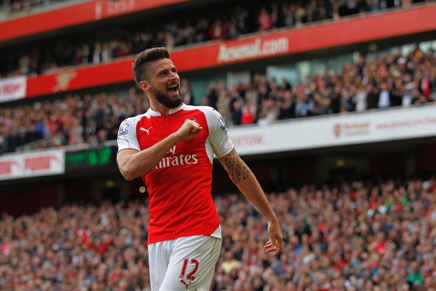 Arsenal's French striker Olivier Giroud celebrates scoring his team's third goal during the English Premier League football match between Arsenal and Aston Villa at the Emirates Stadium in London on May 15, 2016.  / AFP / Ian Kington / RESTRICTED TO EDITORIAL USE. No use with unauthorized audio, video, data, fixture lists, club/league logos or 'live' services. Online in-match use limited to 75 images, no video emulation. No use in betting, games or single club/league/player publications.  /         (Photo credit should read IAN KINGTON/AFP/Getty Images)