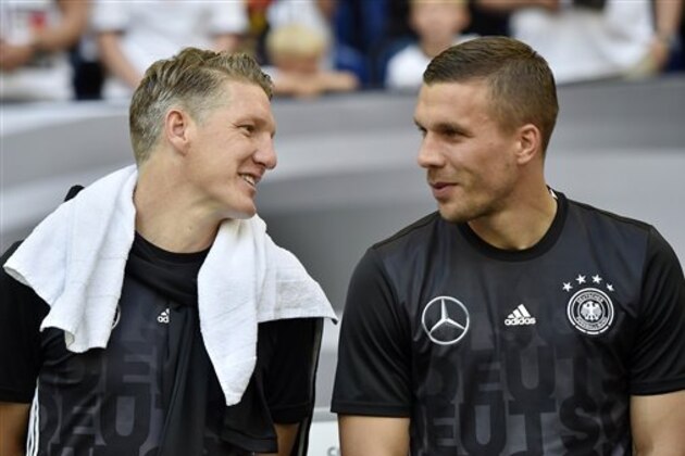 Germany’s Bastian Schweinsteiger , left, and Germany’s Lukas Podolski stand at the bench prior the international friendly soccer match between Germany and Hungary in Gelsenkirchen, Germany, Saturday, June 4, 2016. (AP Photo/Martin Meissner)