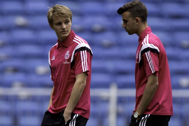 MADRID, SPAIN - APRIL 29:  Martin Odegaard of Real Madrid CF and team-mate Borja Mayoral leave the pitch before the La Liga match between Real Madrid CF and UD Almeria at Estadio Santiago Bernabeu on April 29, 2015 in Madrid, Spain.  (Photo by Gonzalo Arroyo Moreno/Getty Images)