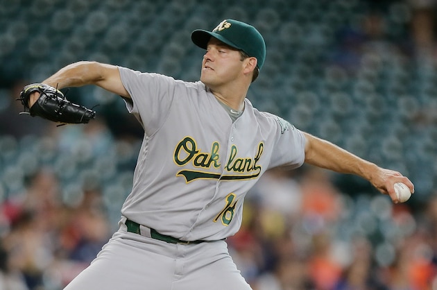 HOUSTON, TX - JULY 07:  Rich Hill #18 of the Oakland Athletics pitches in the first inning against the Houston Astros at Minute Maid Park on July 7, 2016 in Houston, Texas.  (Photo by Bob Levey/Getty Images)