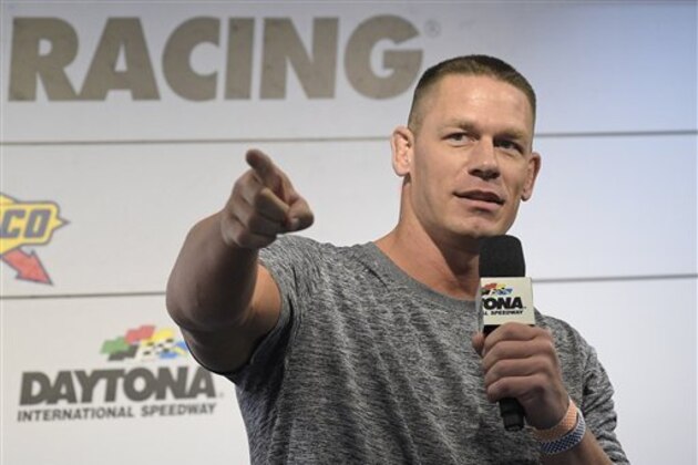 Professional wrestler John Cena answers question from the media during a news conference before the NASCAR Daytona 500 Sprint Cup Series auto race at Daytona International Speedway in Daytona Beach, Fla., Sunday, Feb. 21, 2016. (AP Photo/Phelan M. Ebenhack)