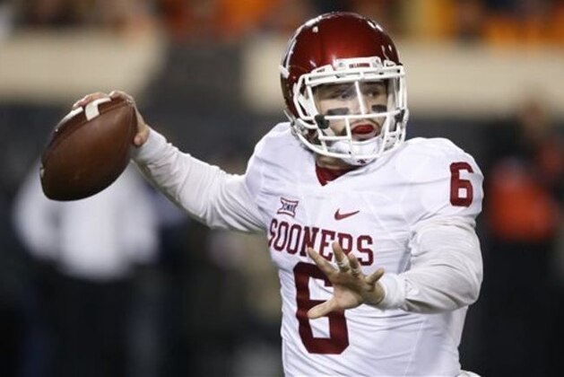Oklahoma quarterback Baker Mayfield (6) passes in the second quarter of an NCAA college football game against Oklahoma State in Stillwater, Okla., Saturday, Nov. 28, 2015. (AP Photo/Sue Ogrocki)