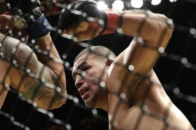 Cain Velasquez, right, fights Travis Browne during their heavyweight mixed martial arts bout at UFC 200, Saturday, July 9, 2016, in Las Vegas. (AP Photo/John Locher)
