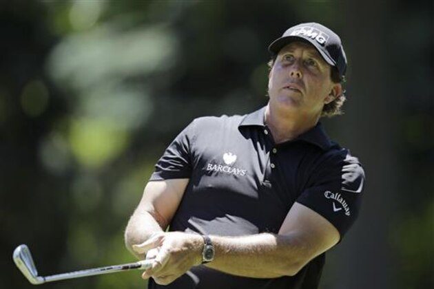 Phil Mickelson hits on the seventh hole during the first round of the Bridgestone Invitational golf tournament at Firestone Country Club, Thursday, June 30, 2016, in Akron, Ohio. (AP Photo/Tony Dejak)