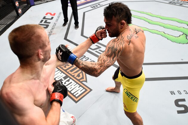SIOUX FALLS, SD - JULY 13:   (R-L) John Lineker punches Michael McDonald in their bantamweight bout during the UFC Fight Night event on July 13, 2016 at Denny Sanford Premier Center in Sioux Falls, South Dakota. (Photo by Jeff Bottari/Zuffa LLC/Zuffa LLC via Getty Images)