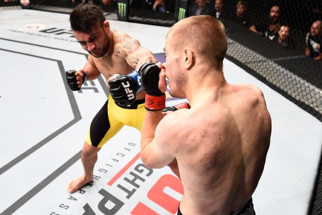 SIOUX FALLS, SD - JULY 13:   (L-R) John Lineker punches Michael McDonald in their bantamweight bout during the UFC Fight Night event on July 13, 2016 at Denny Sanford Premier Center in Sioux Falls, South Dakota. (Photo by Jeff Bottari/Zuffa LLC/Zuffa LLC via Getty Images)